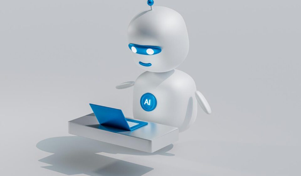 a white robot with blue eyes and a laptop