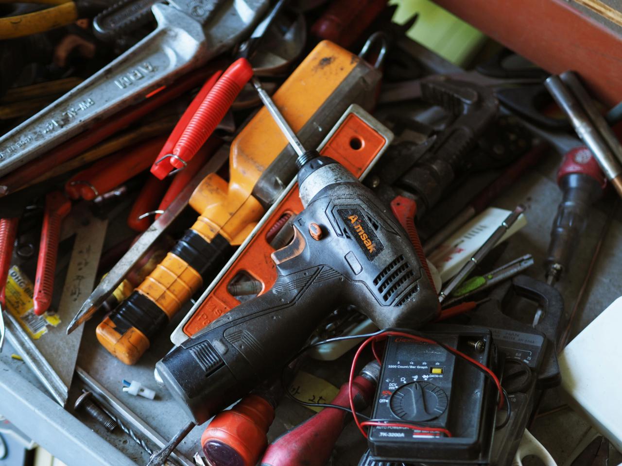 black and orange cordless power drill