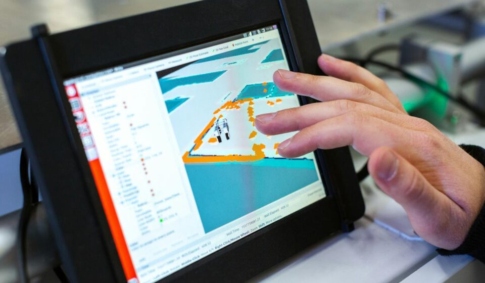 person holding black tablet computer